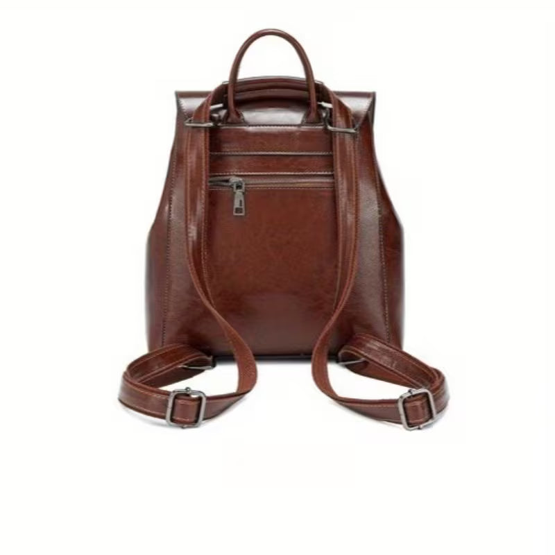 Brown leather backpack on a white background