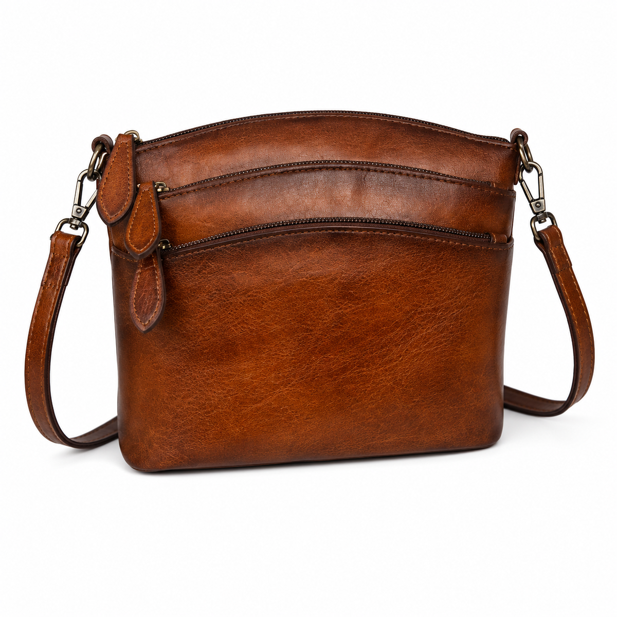 A brown leather crossbody bag with a curved top, two horizontal zipper compartments, and a matching shoulder strap, shown on a plain white background.