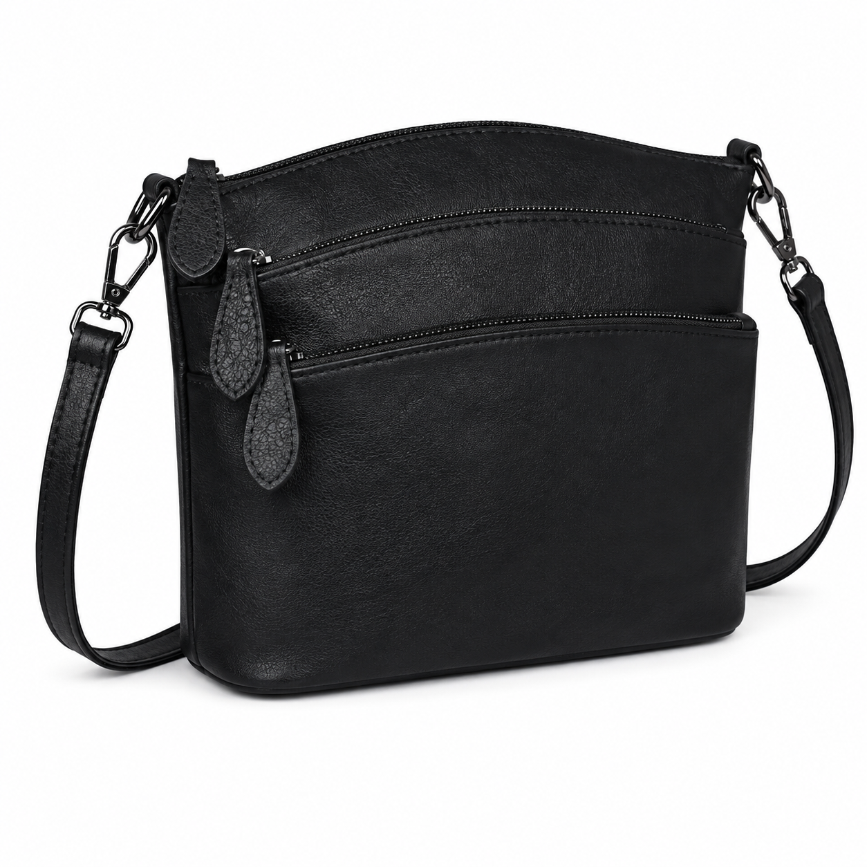 A black faux-leather crossbody bag with a curved top, two front zippered pockets, and a detachable shoulder strap, shown on a plain white background.