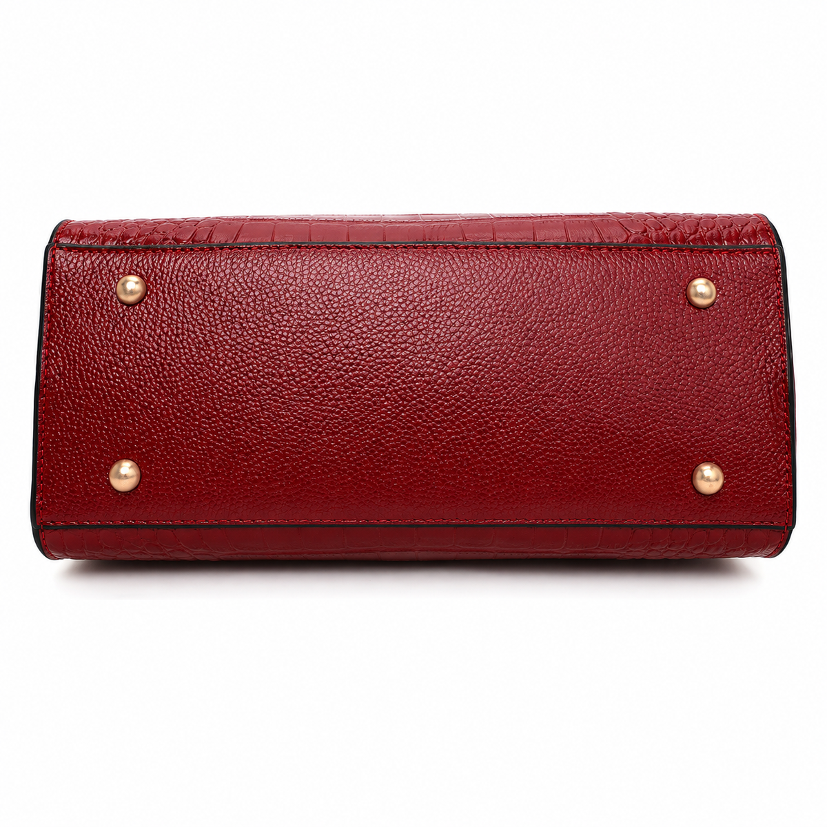 A red pebbled leather clutch or wallet shown from the bottom, featuring four gold-tone metal studs on the corners, set against a plain white background.