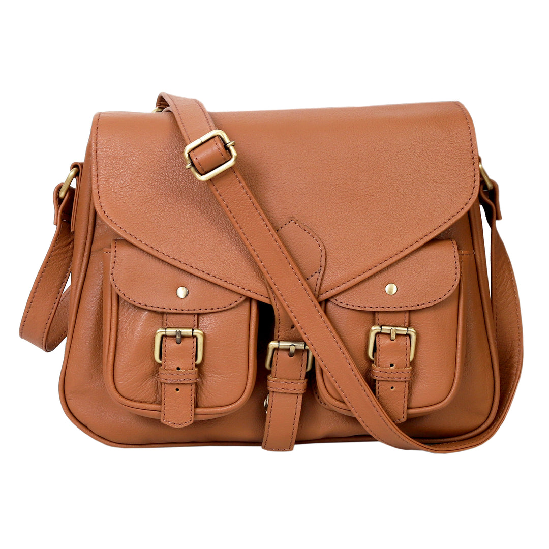 Brown leather satchel bag with gold buckles on a white background