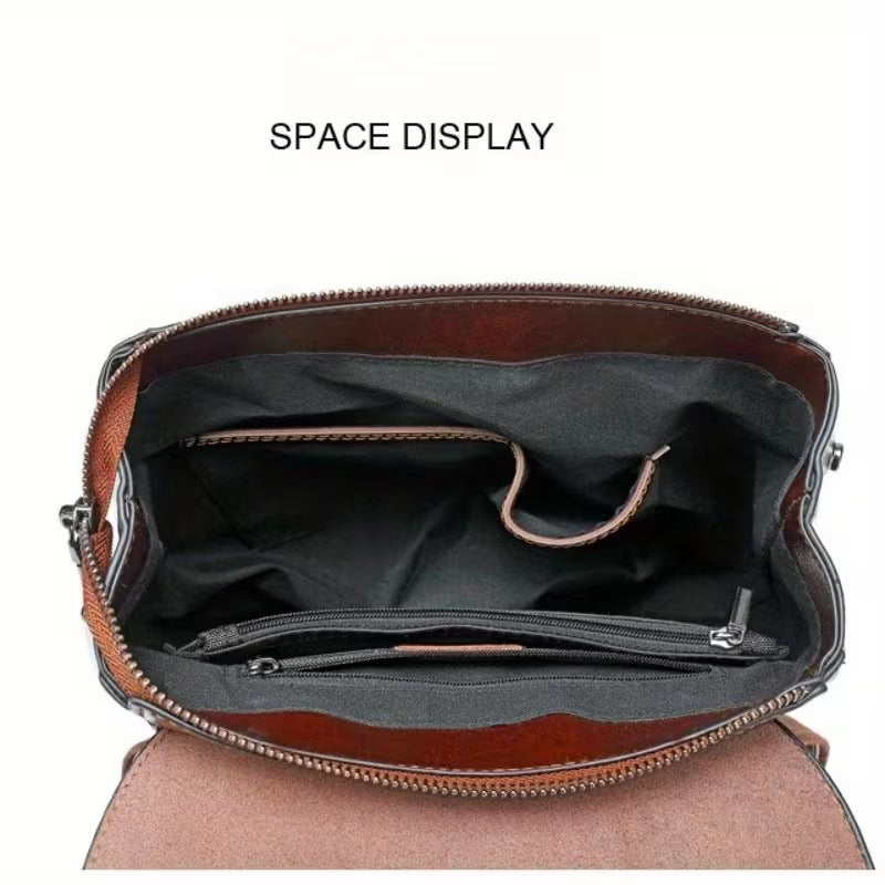 Brown leather bag with open front pocket on a white background