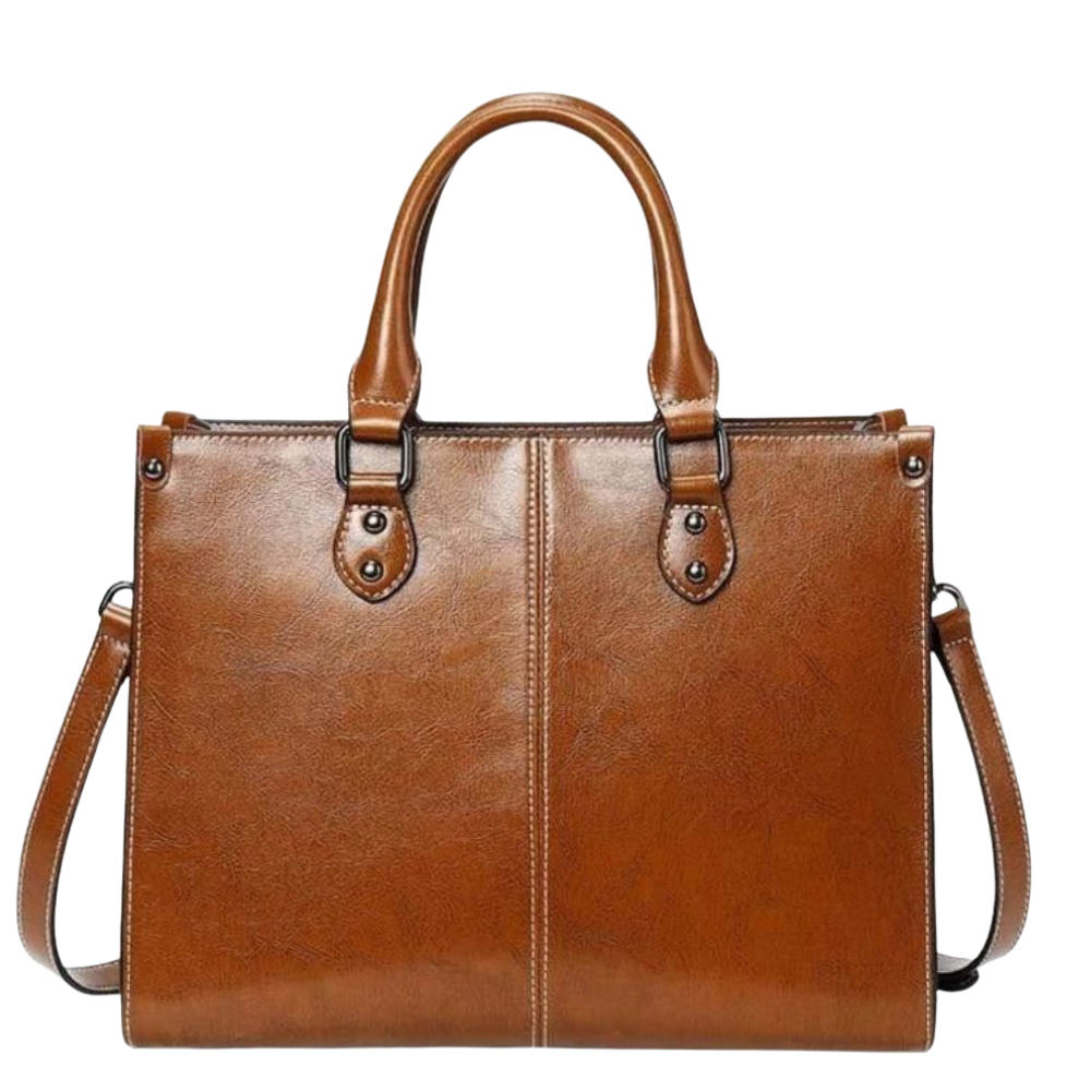 Brown leather handbag with a shoulder strap on a white background