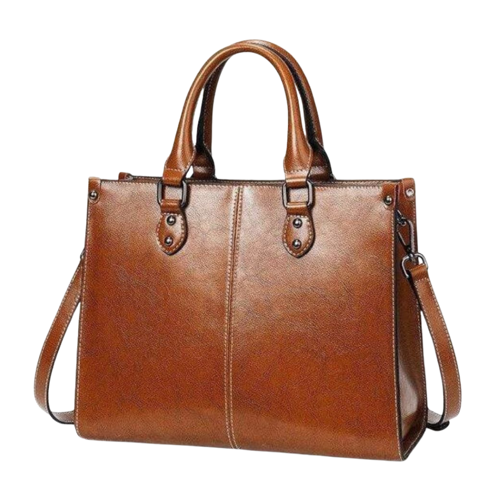 Brown leather handbag with a shoulder strap on a white background