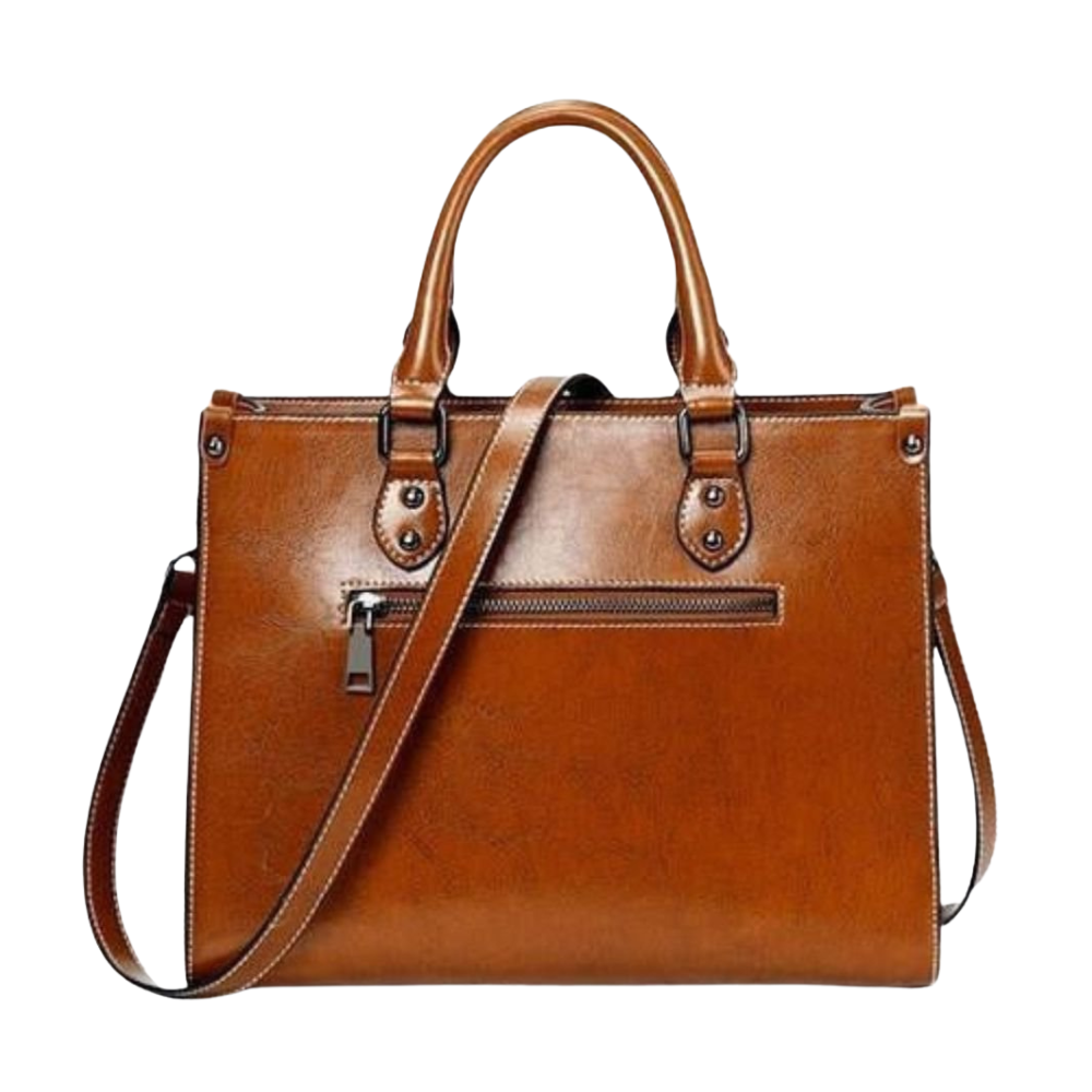 Brown leather handbag with a shoulder strap on a white background